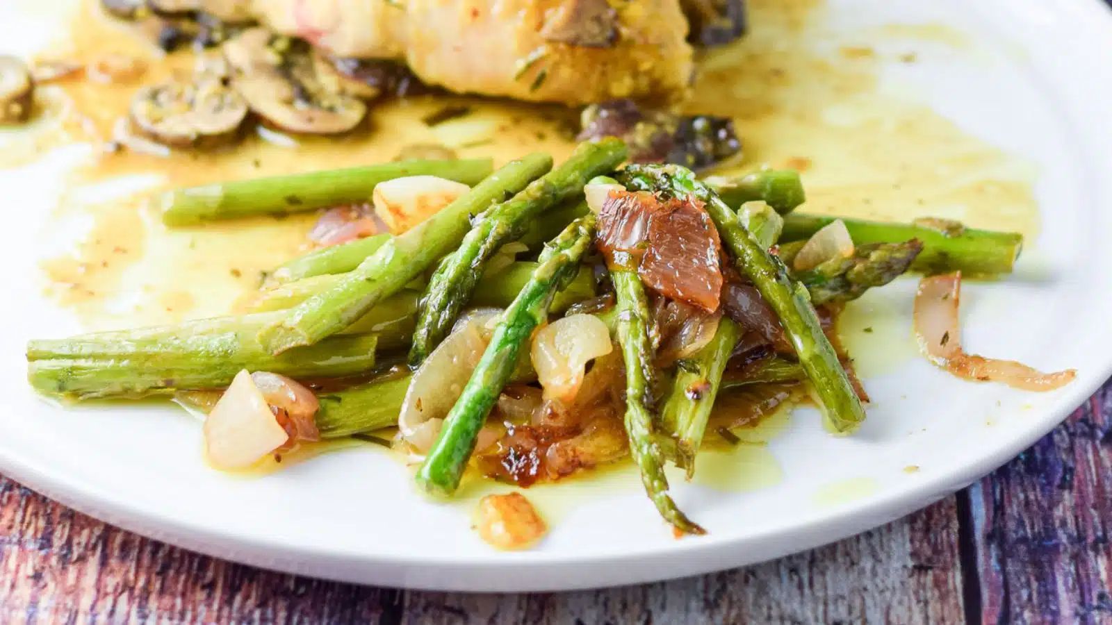 Asparagus and shallots on a plate.