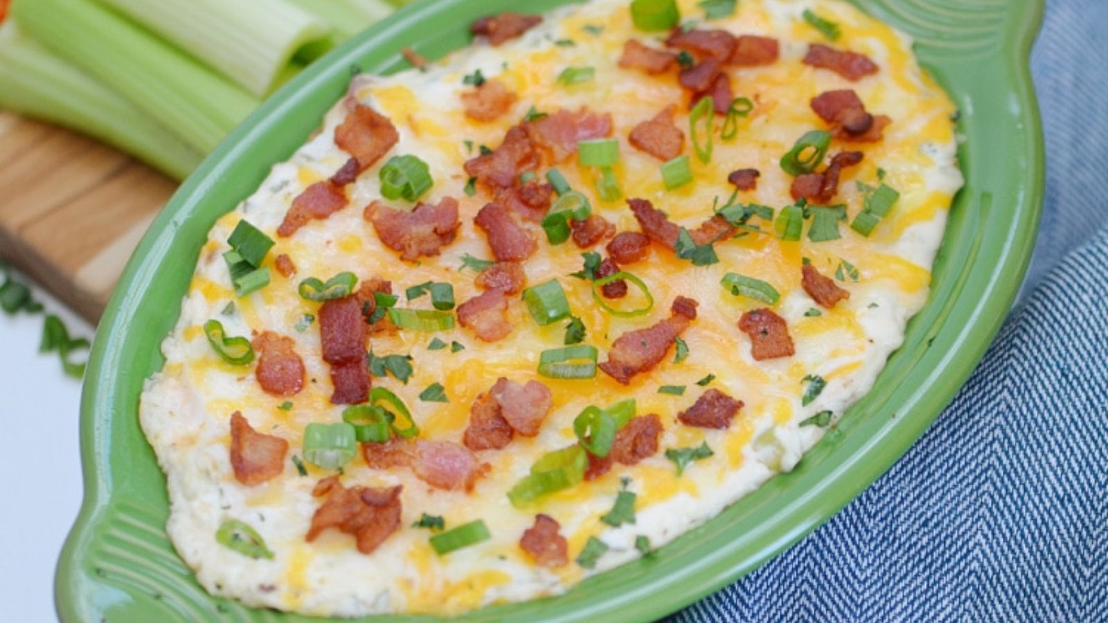 Bacon dip in an oval bowl.