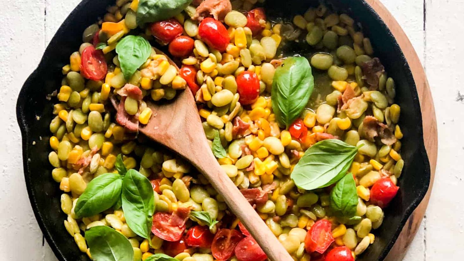 Bacon succotash in a pan.