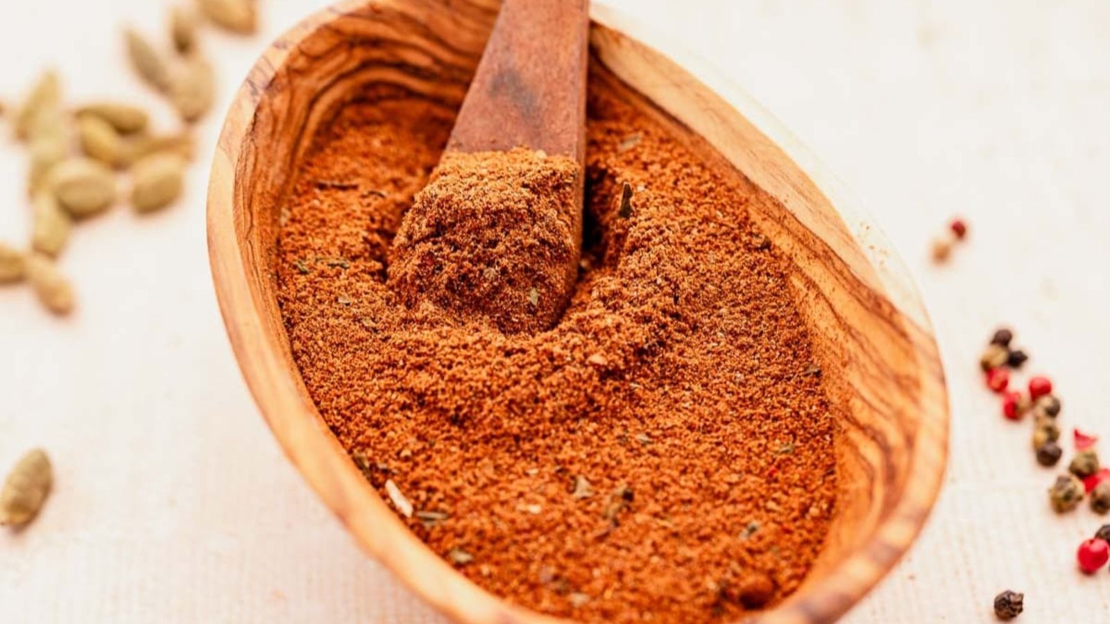 Spice mix in a wooden bowl.