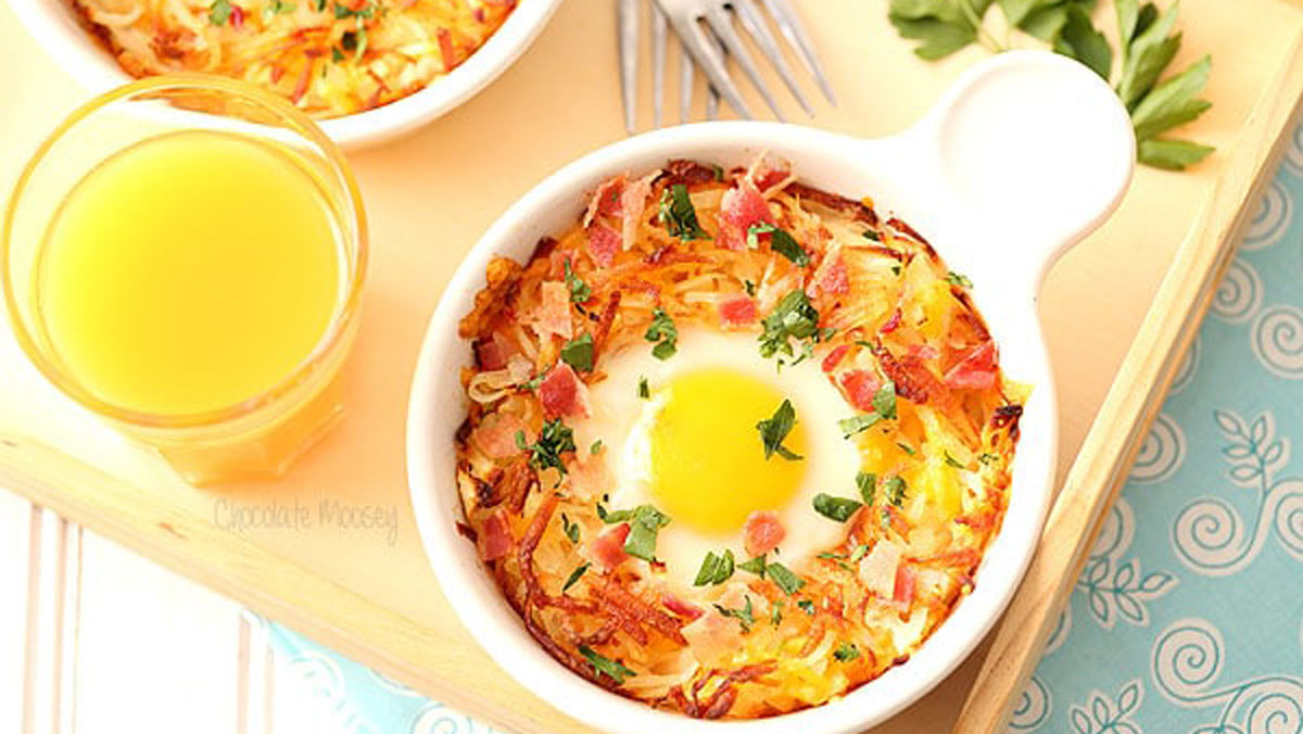 Baked egg in a white bowl with a handle.