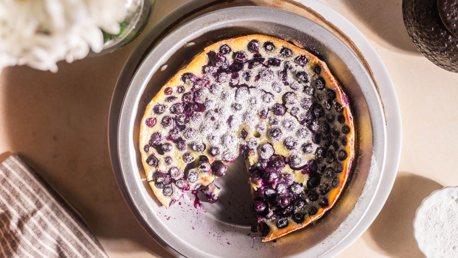 Blueberry clafoutis in a metal baking pan.