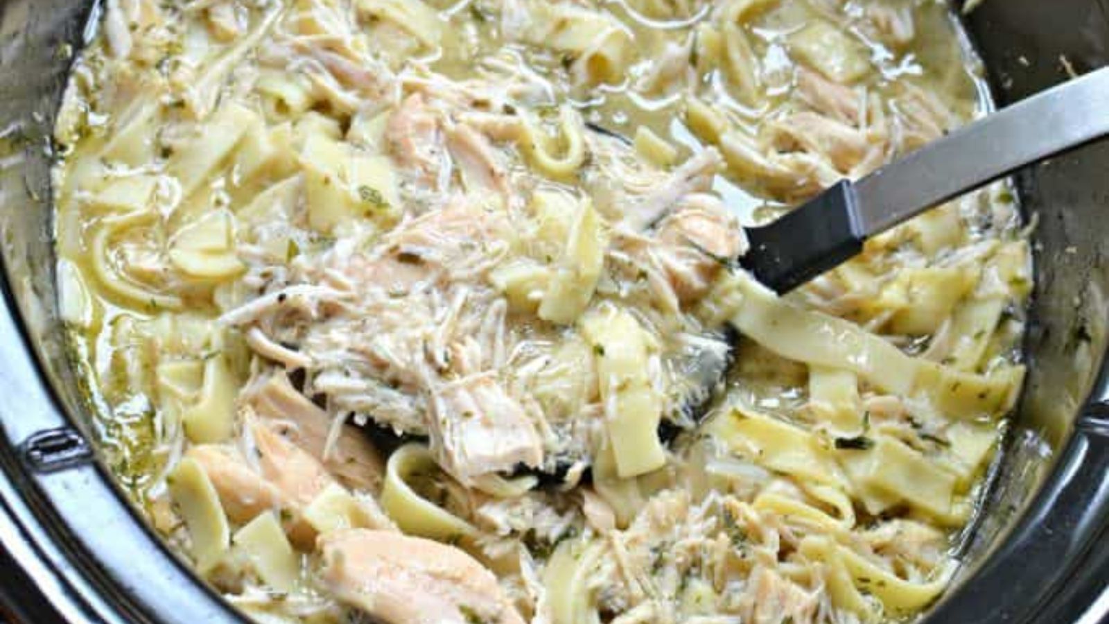 Chicken and noodles in a crockpot.