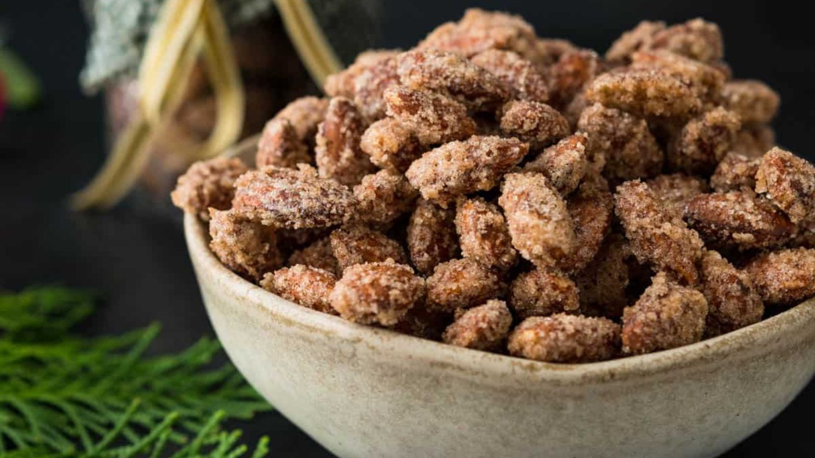 Nuts with cinnamon powder in a bowl.