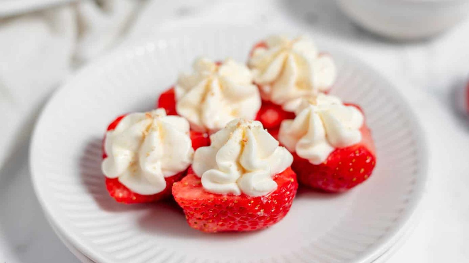 Deviled strawberries on a plate.