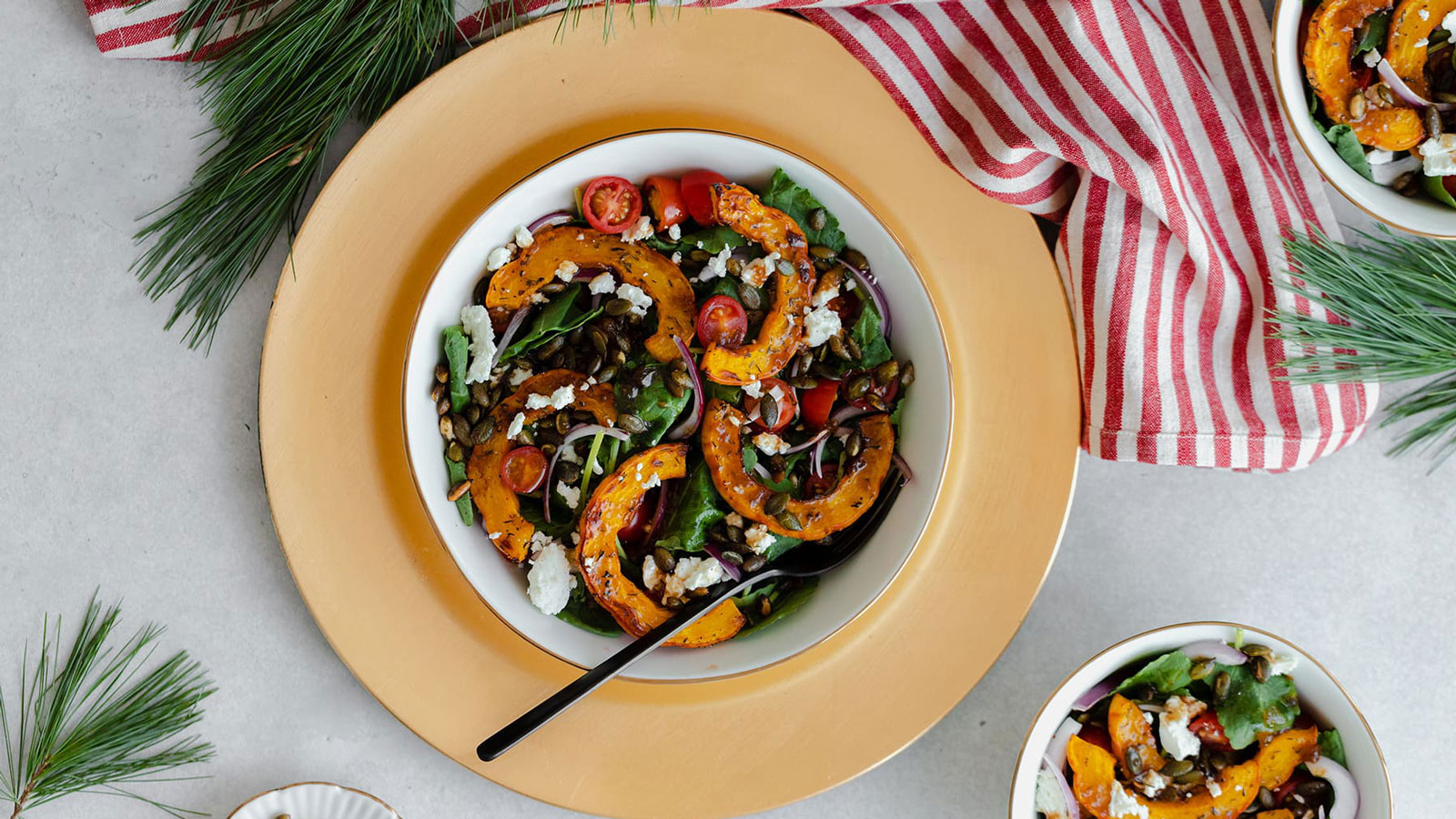 Delicious, colorful salad topped with squash and tomatoes.