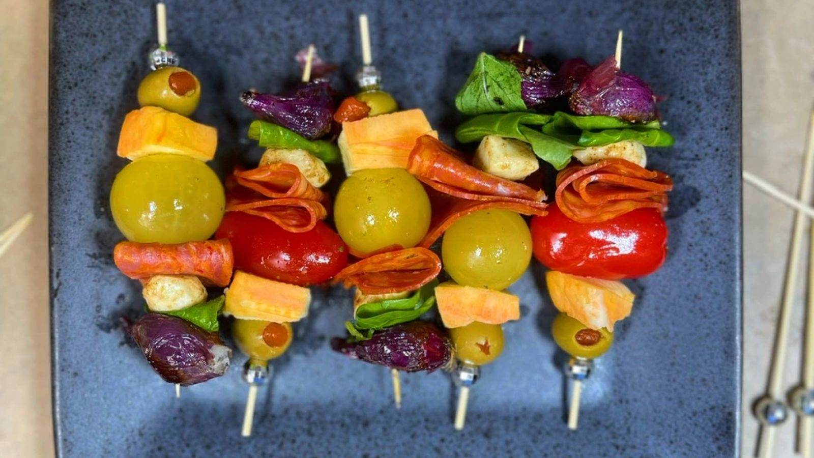 Charcuterie skewers on a tray.