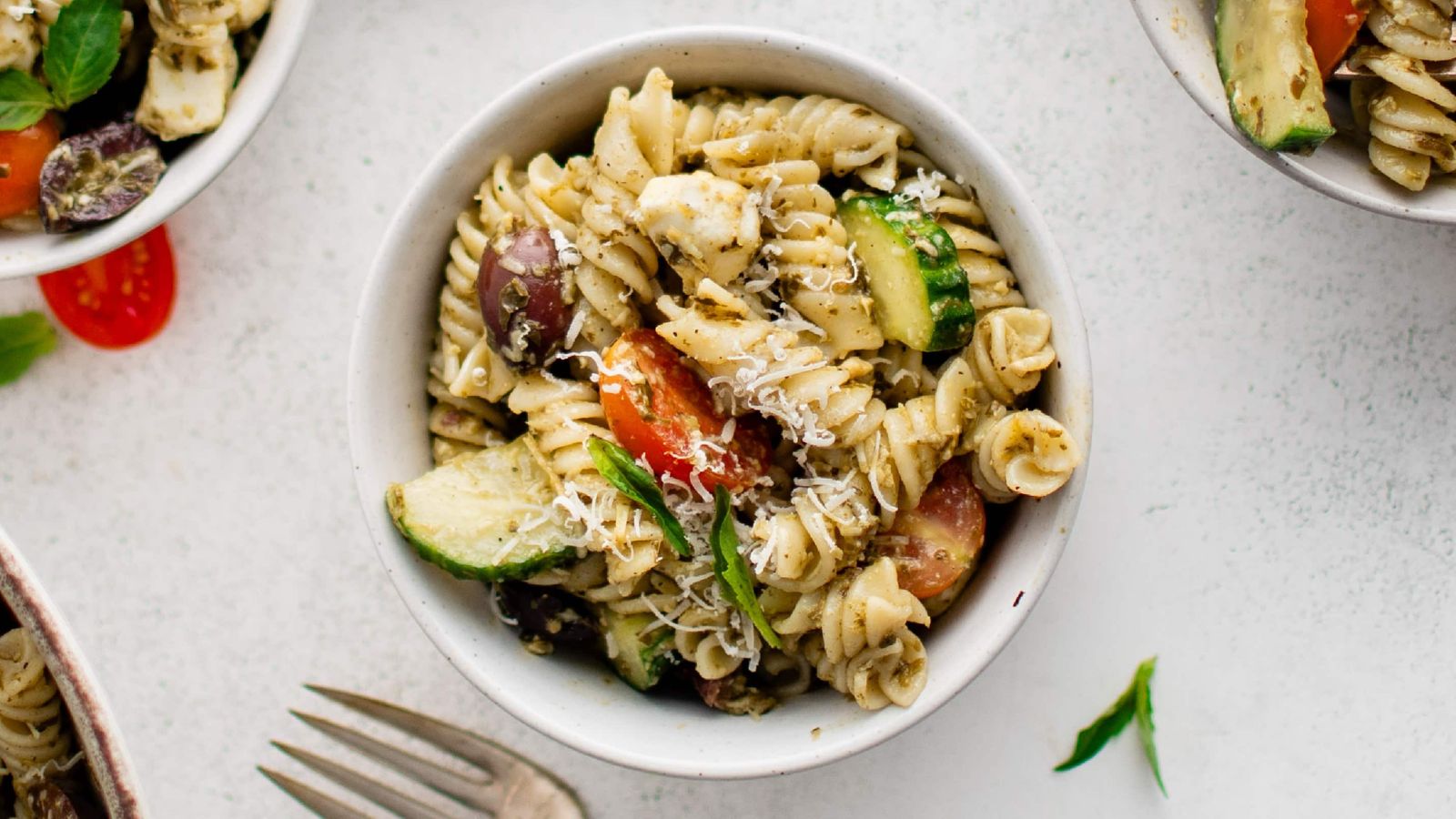 Pesto pasta salad in a bowl.