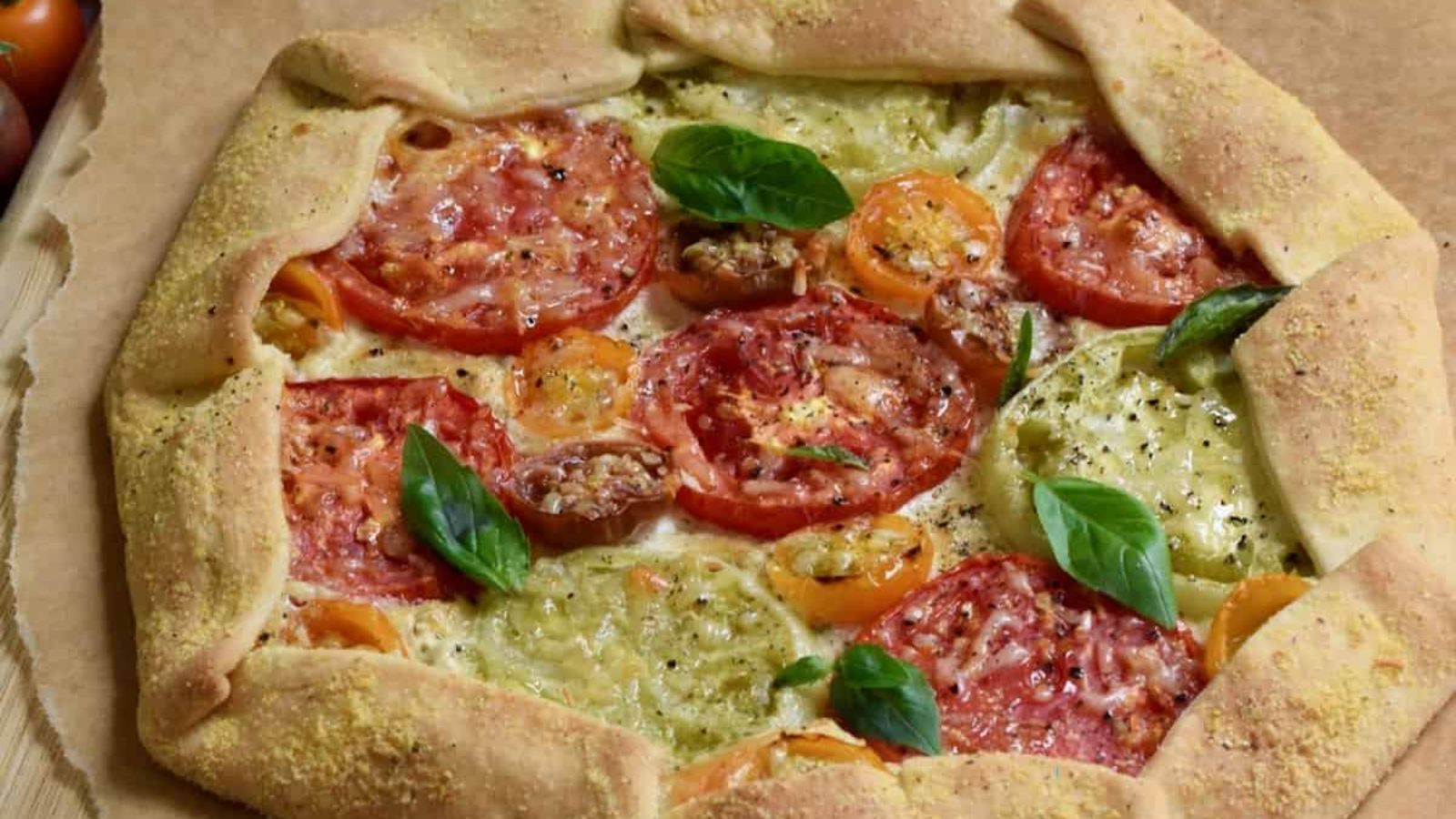 Tomato galette on a parchemtn paper.