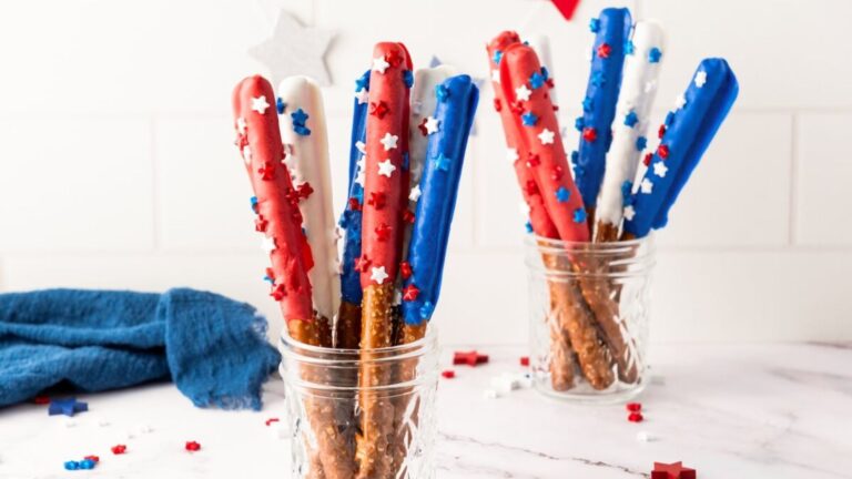Firecracker pretzel rods in a glass.