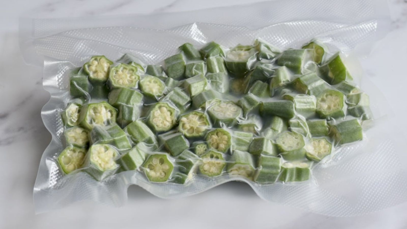 Frozen okra in plastic.