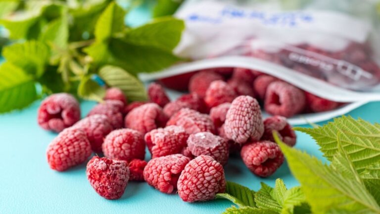 Frozen berries with raspberry leaves.