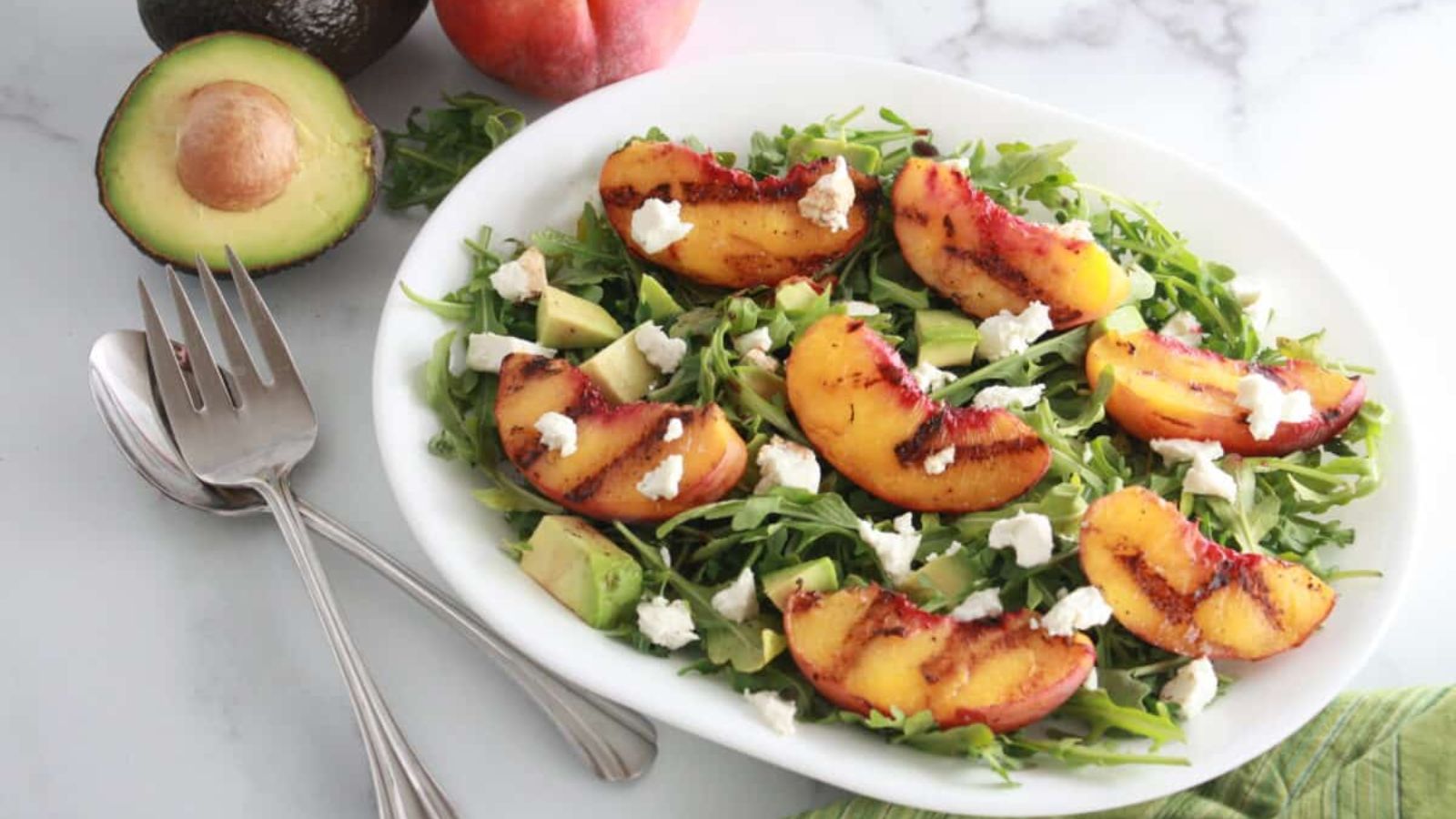 Grilled Peach & Goat Cheese Salad on a plate. 