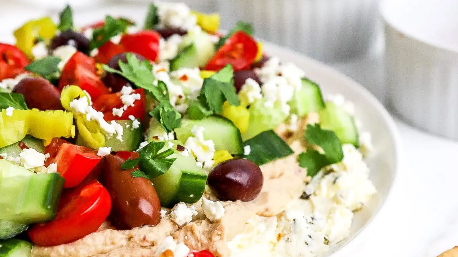 Greek layer dip on a plate.