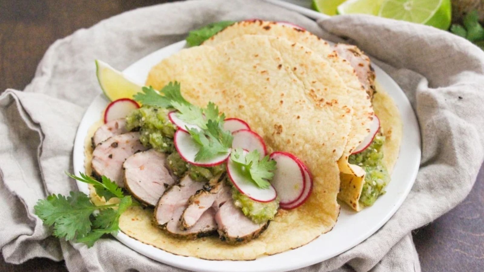 Pork tenderloin tacos on a plate.