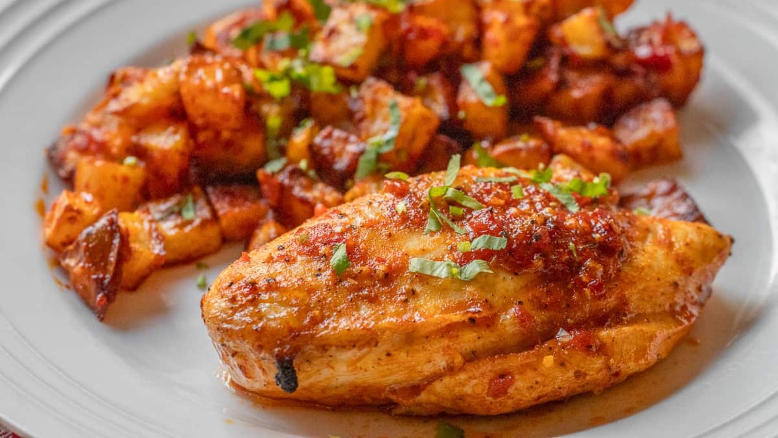 Harissa chicken on a plate.