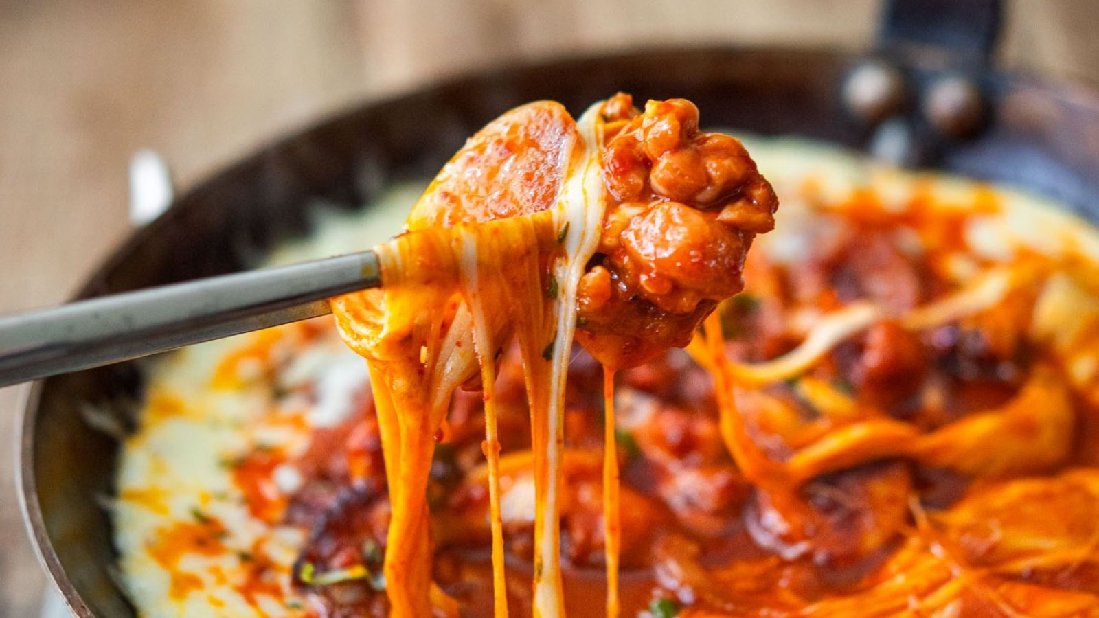 Hot cheese buldak on a chopstick.