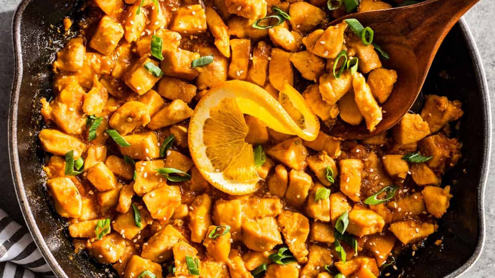 Orange chicken in a pan.