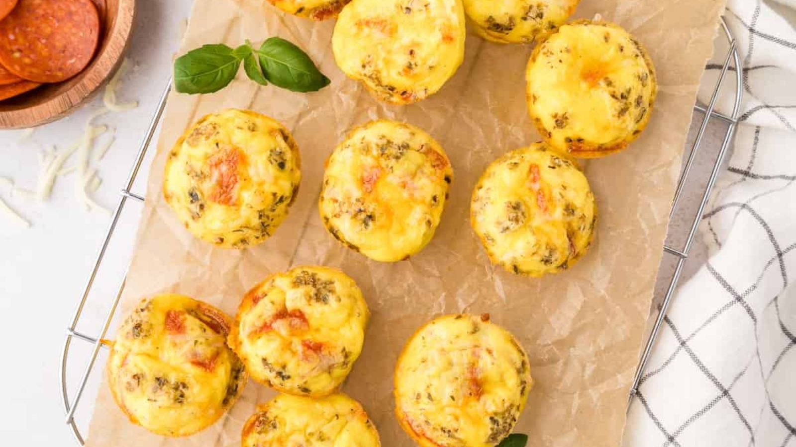 Mini quiches on a board.