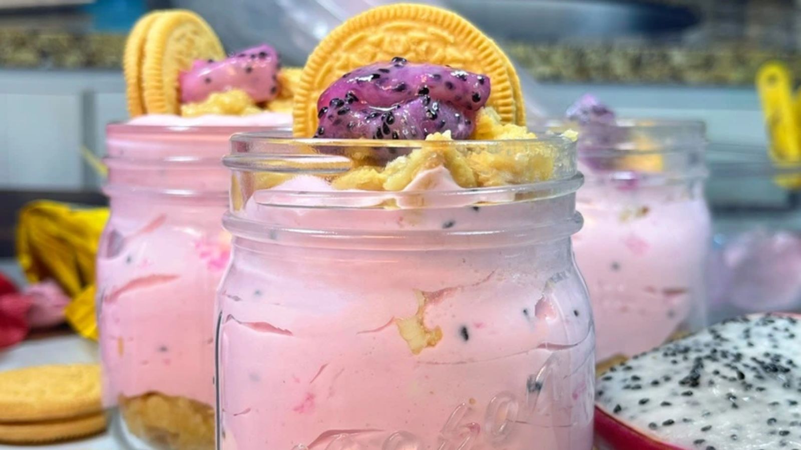 Dragon fruit cheesecake in mason jar.