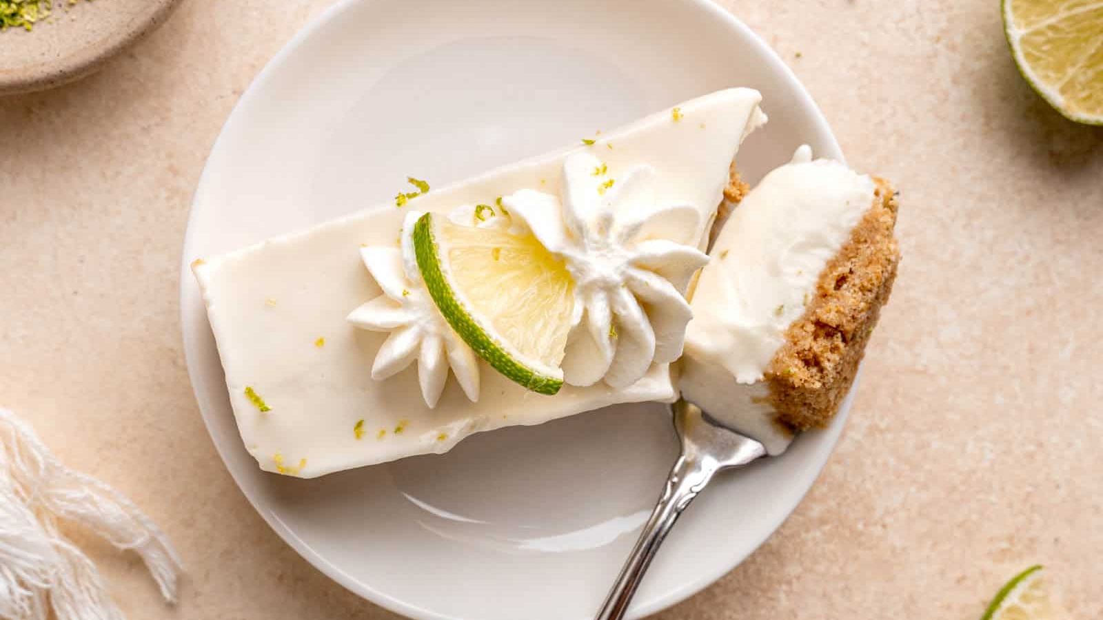 A slice pf lime cheesecake on a plate.
