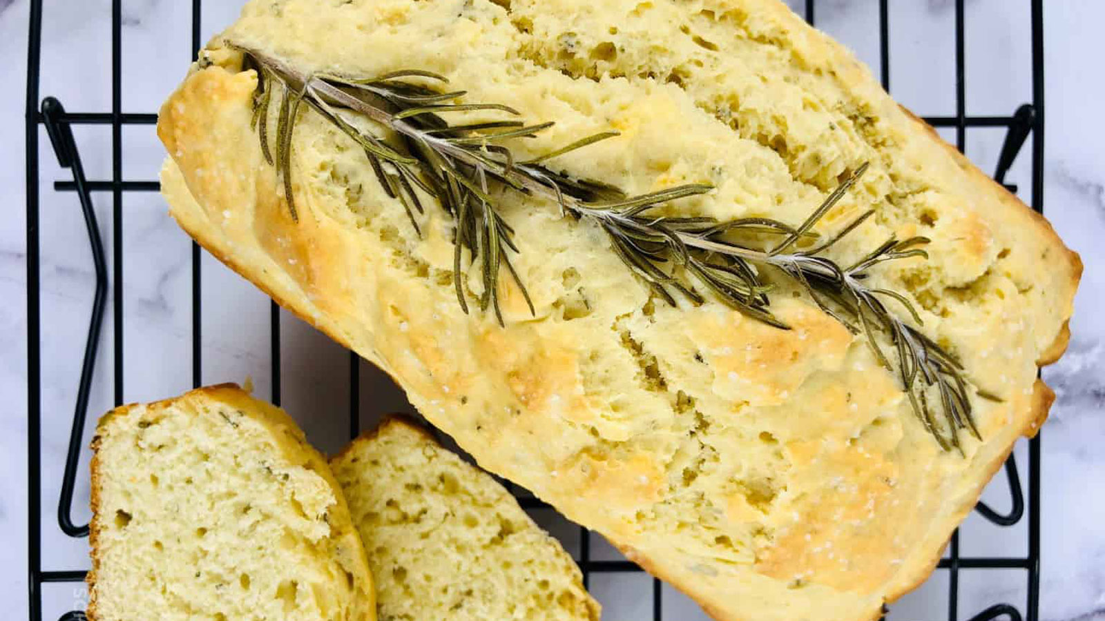 Rosemary olive oil bread on a wire rack.