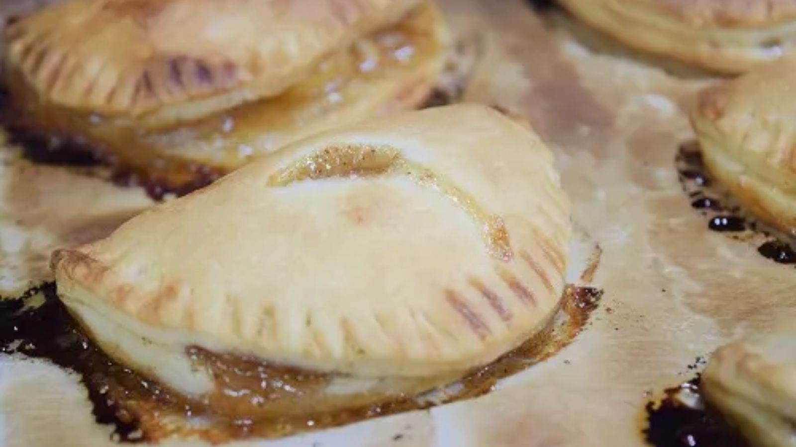 Peach hand pies on a tray.