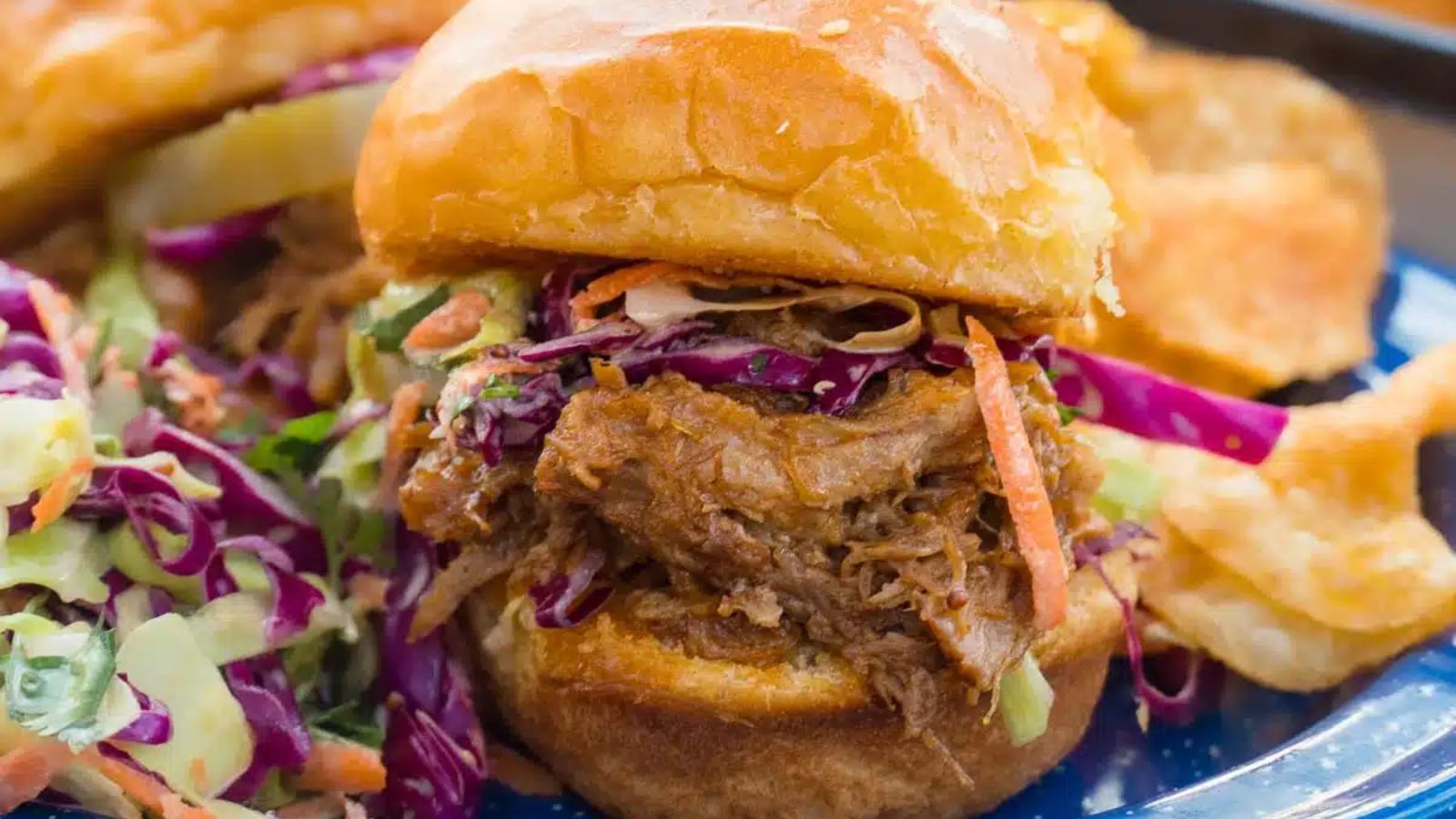 Pulled pork sliders on a plate.