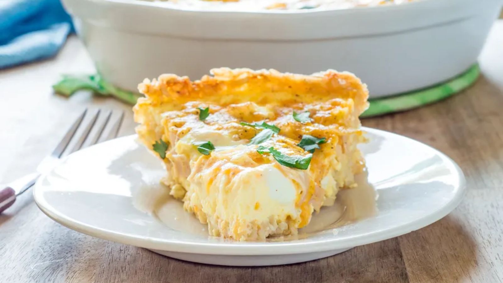 Sliced of quiche with rice on a plate.