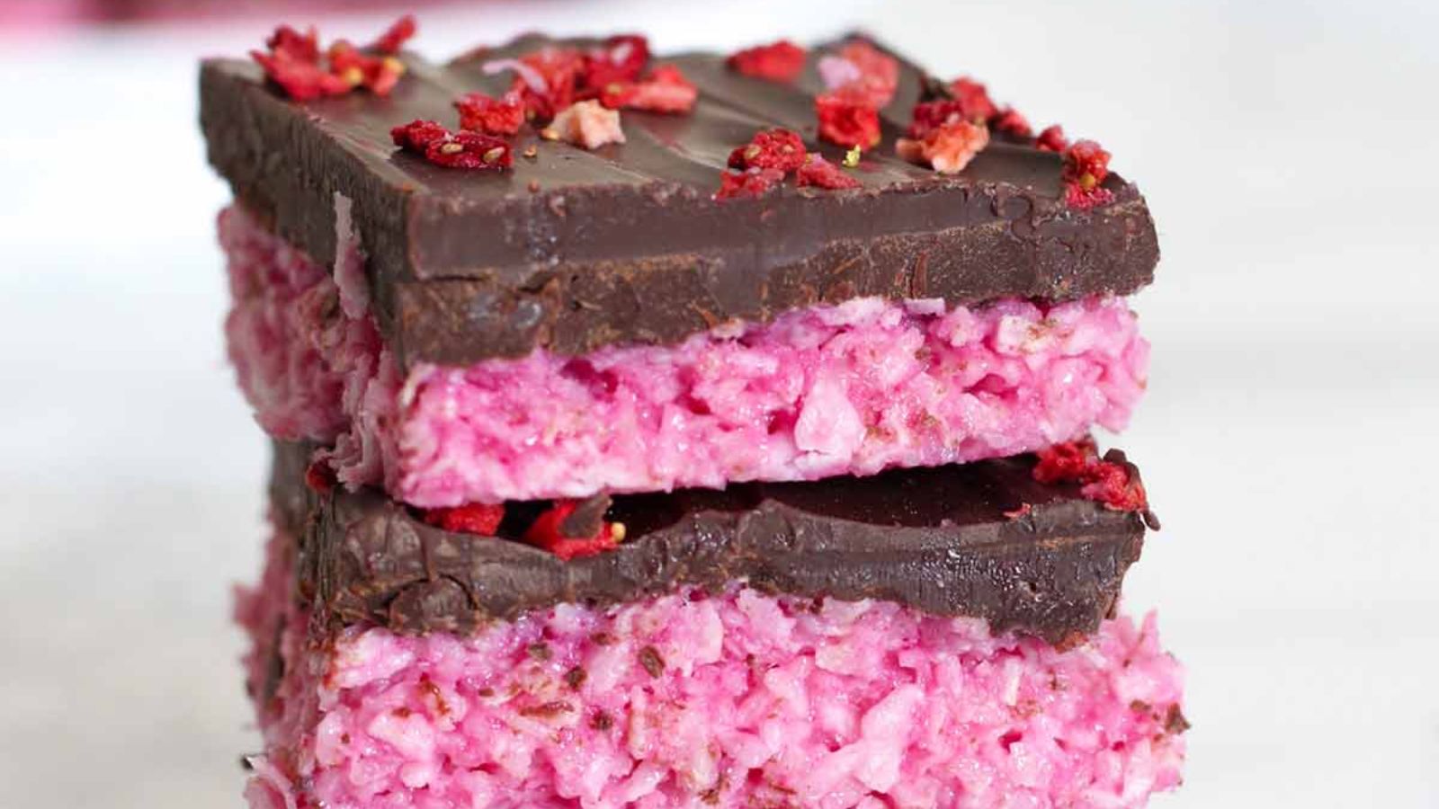 Close up shot of raspberry traybake bars.