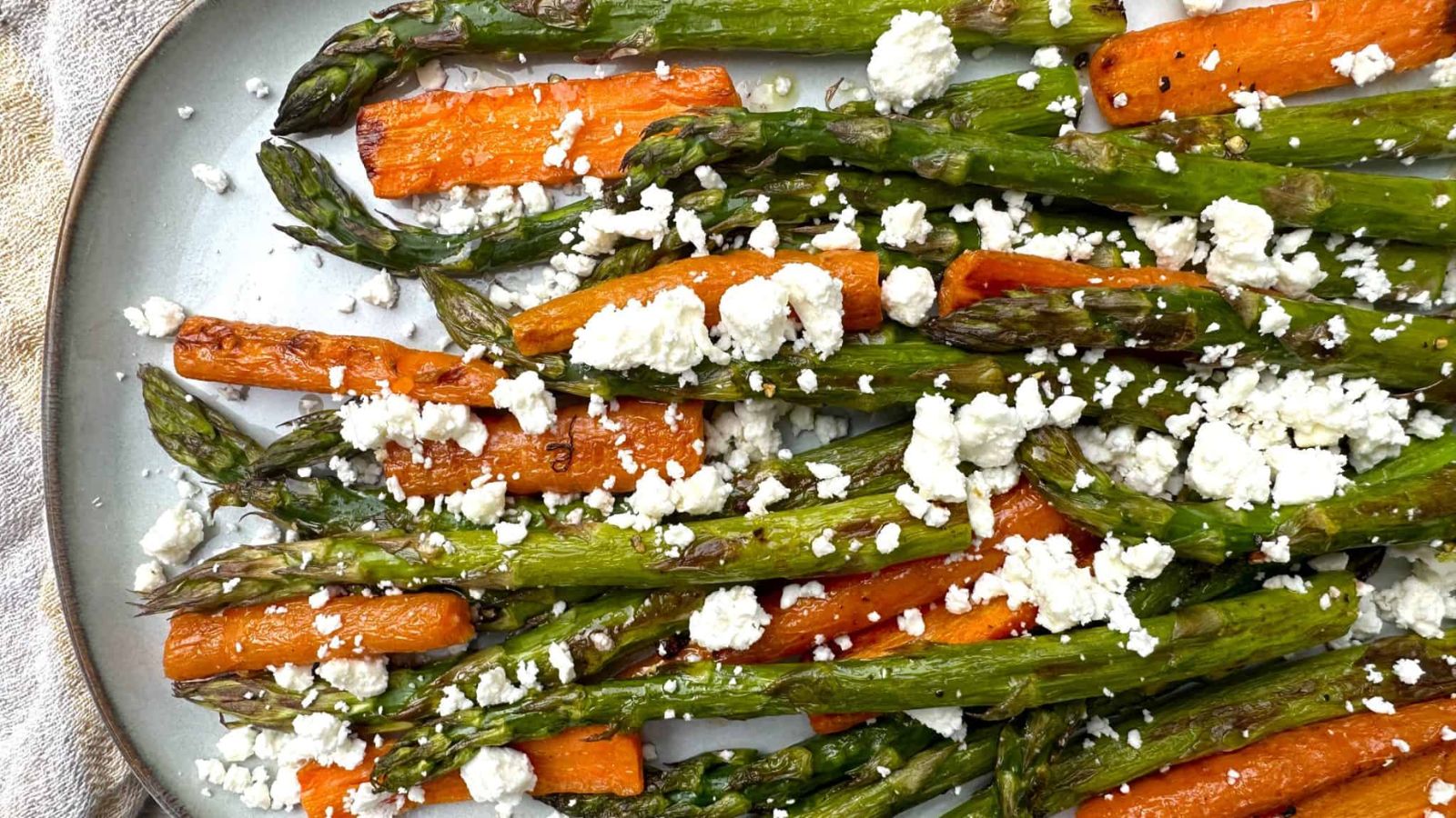 Asparagus and carrots on a plate.