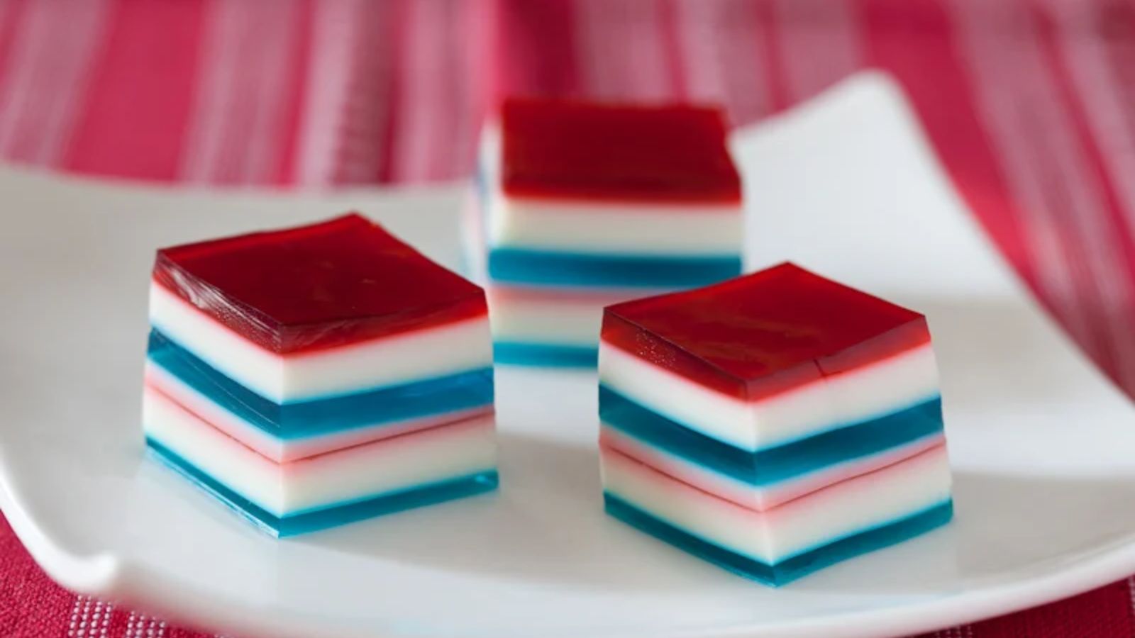 Layered jello on a plate.