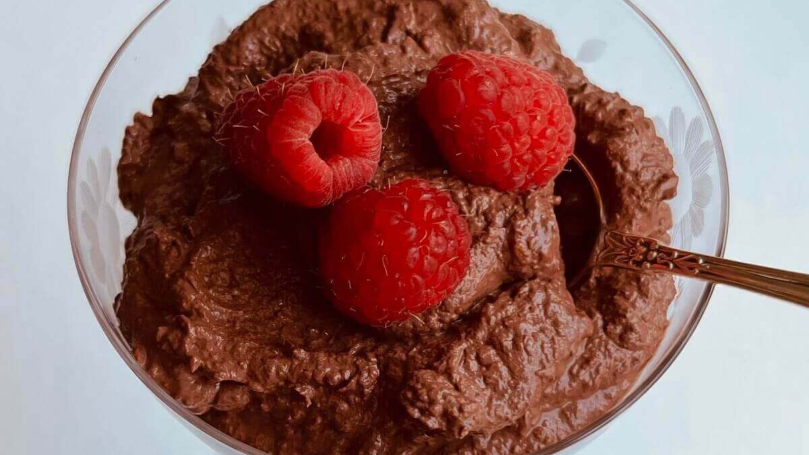 Chocolate mousse with raspberries on top.