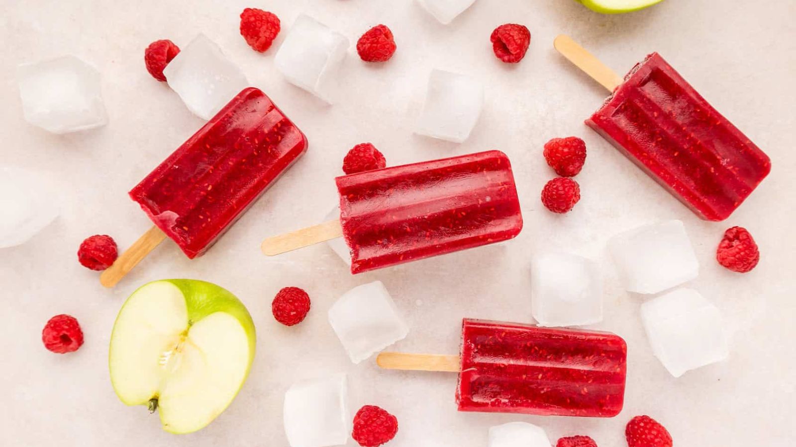 Popsicles with raspberries.