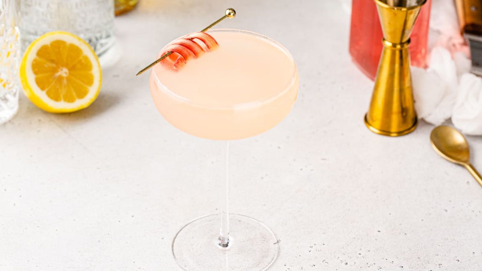 Rhubarb gin cocktail in a glass.
