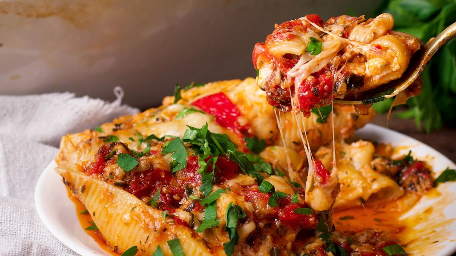 Ricotta stuffed shell on a plate.