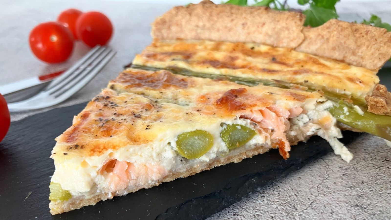 Sliced salmon and asparagus quiche.