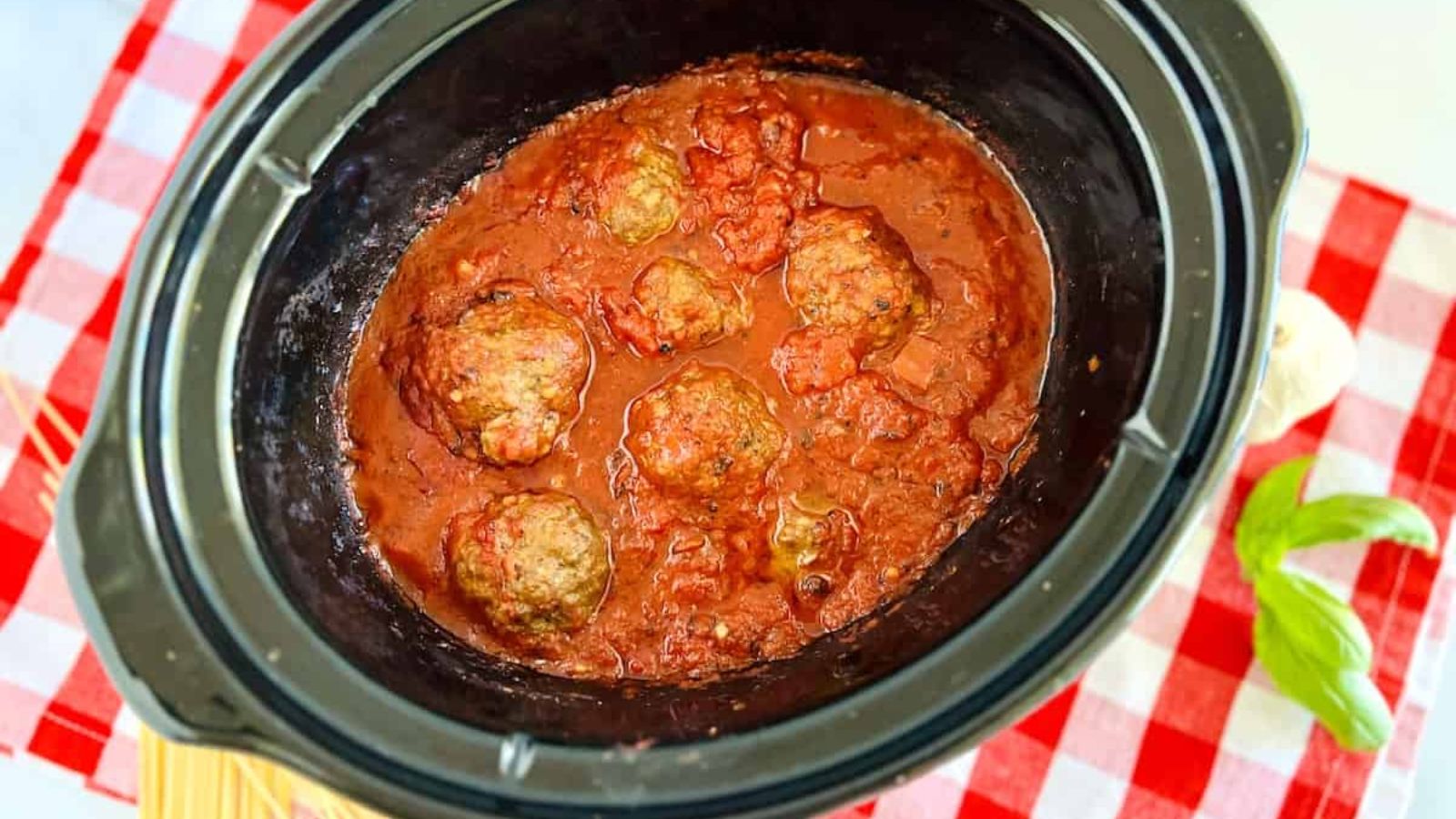 Meatballs with sauce in a pot.