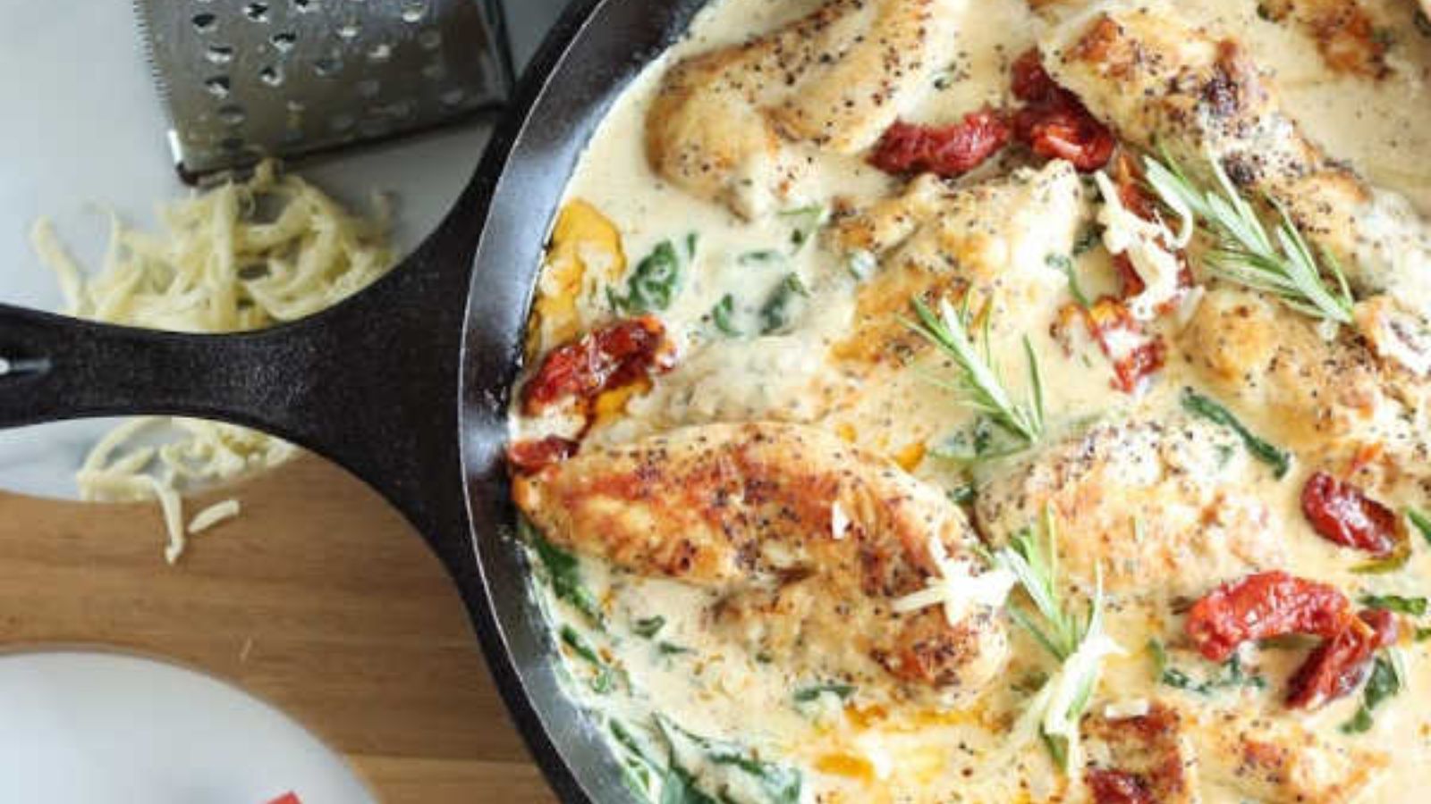 Sun-dried tomato chicken in a pan.