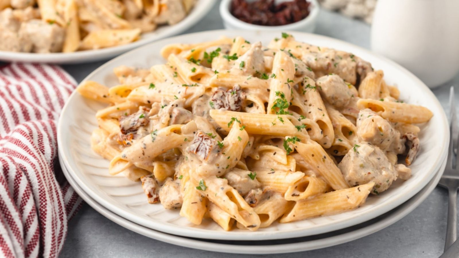 Pasta with chicken on a plate.