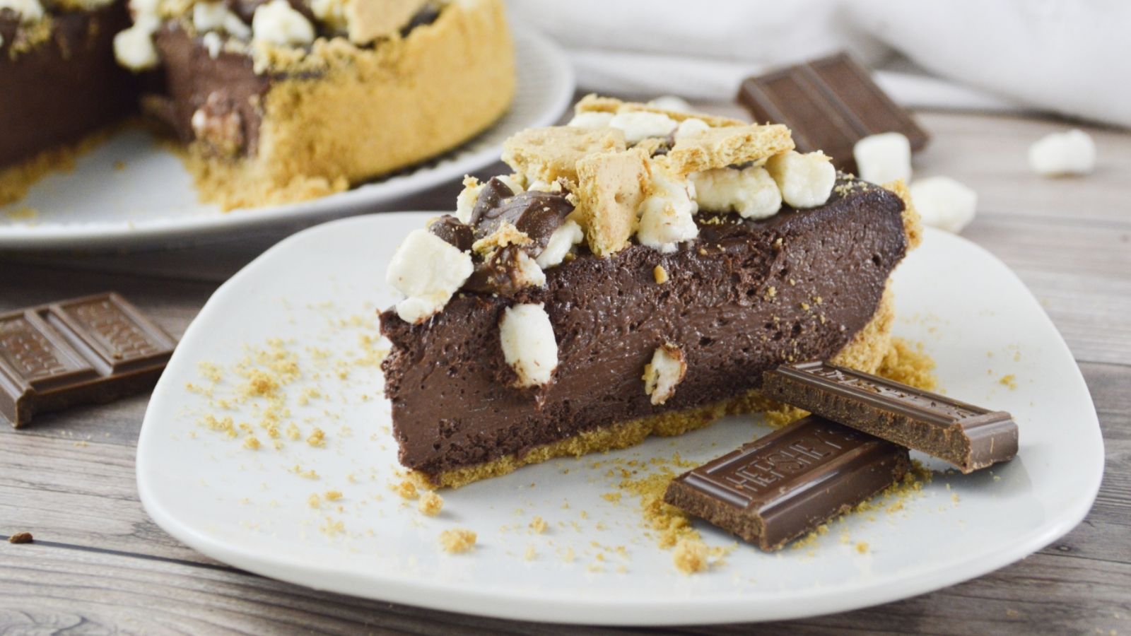 A slice of chocolate s'mores cake on a plate.