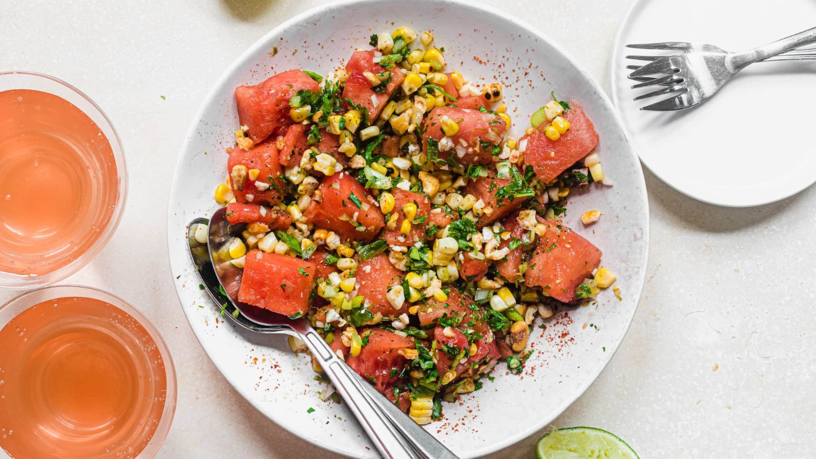 Watermelon jalapeno salad with charred corn on a plate.