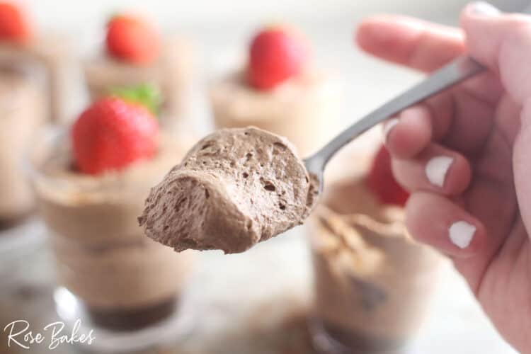Chocolate cheesecake filling on a spoon.