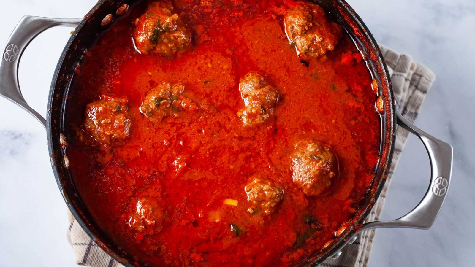 Meatballs in tomato sauce in a pot.