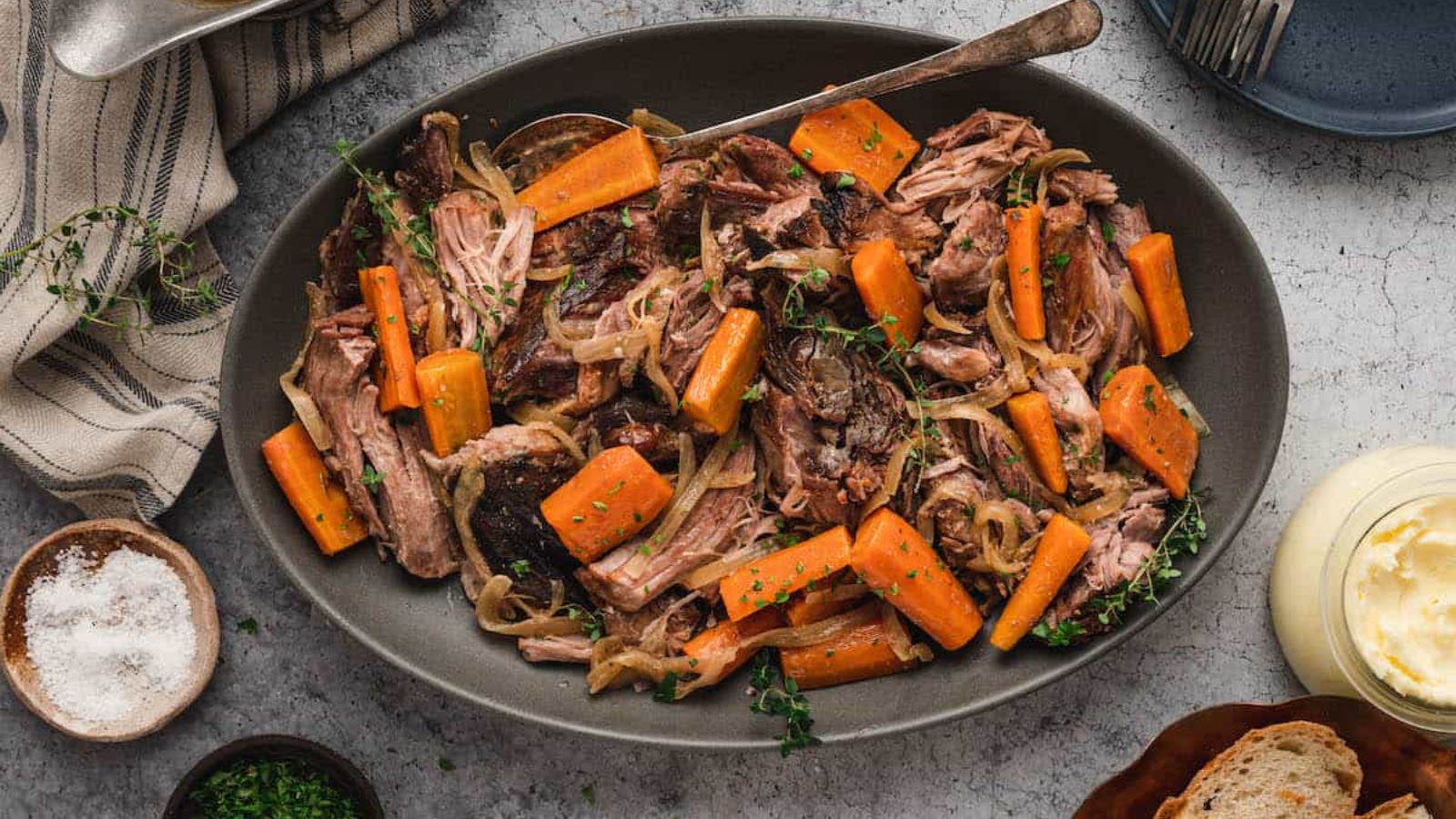 Pork roast with carrots on a plate.