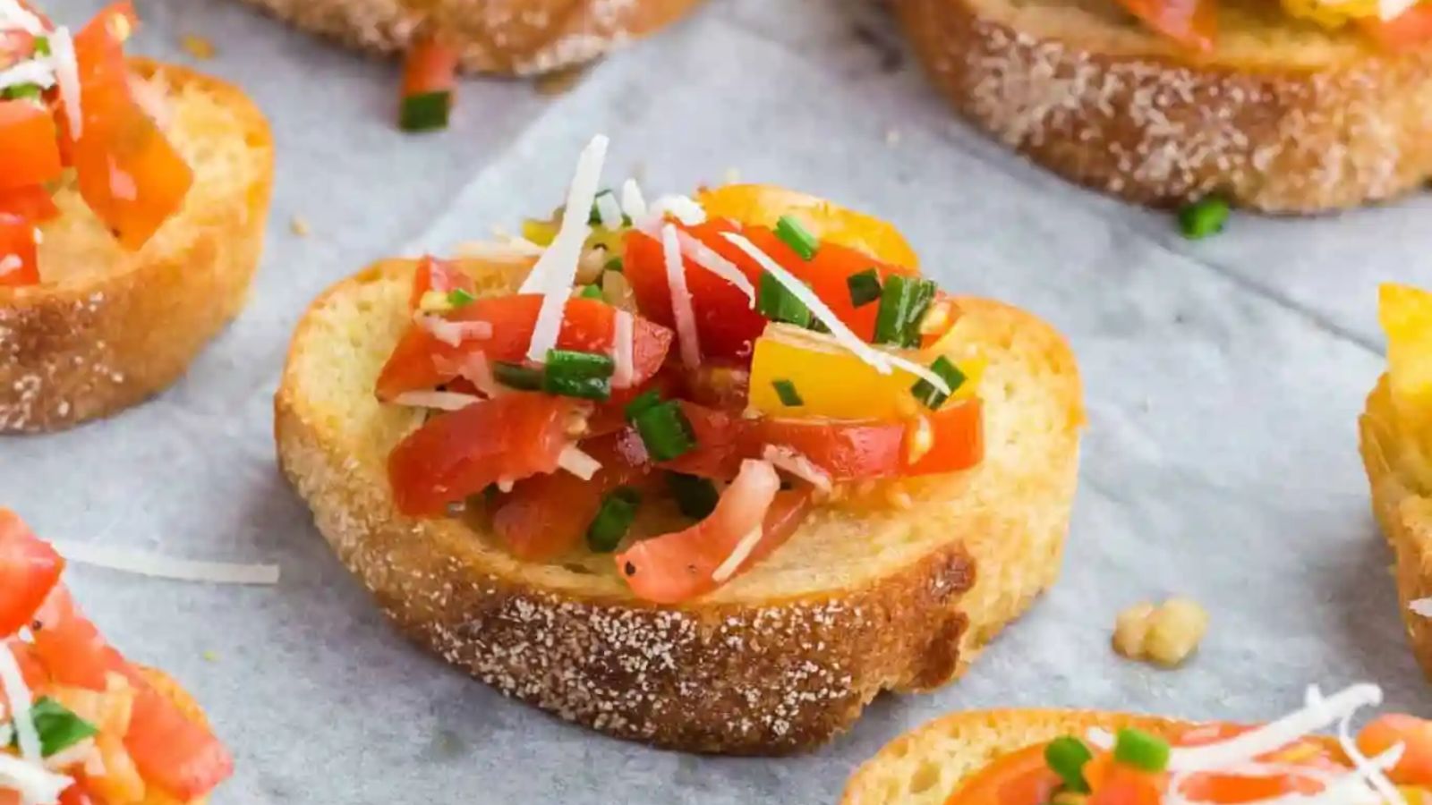 Bruschetta toast with tomatoes on top.