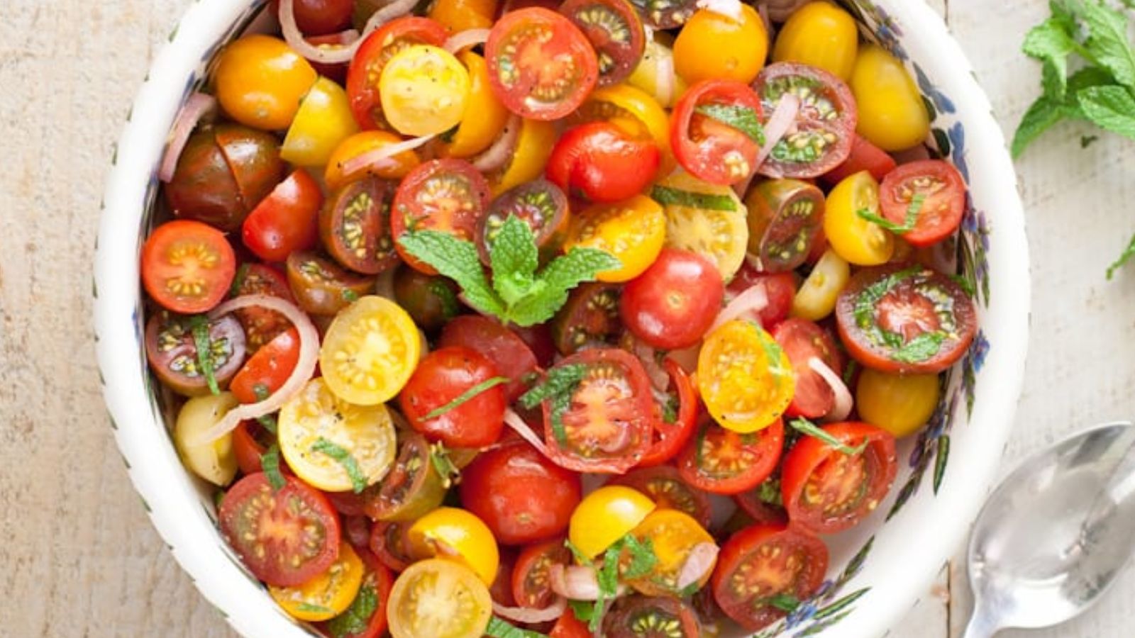 Tomato balsamic mint salad in a bowl.