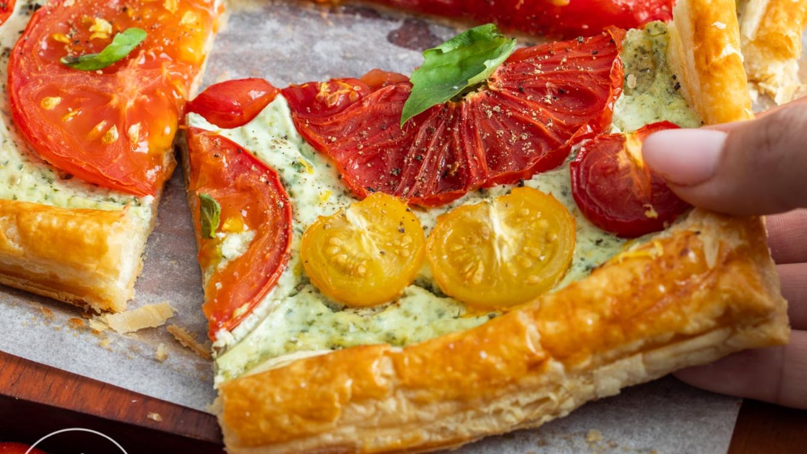 Tomato tart on a wooden board.