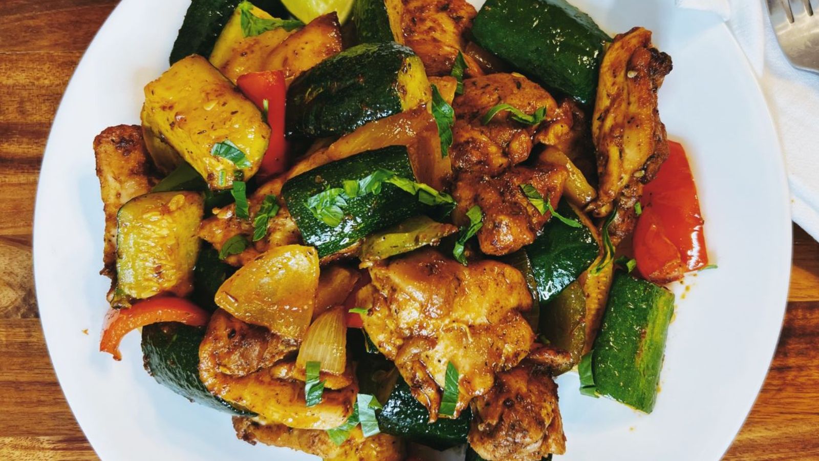 Stir fry chicken on a plate.