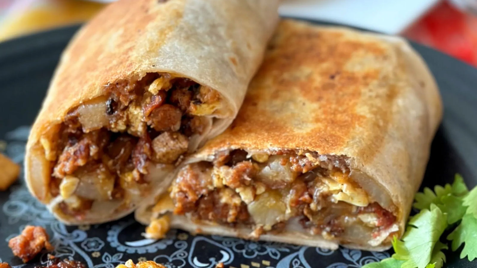 Stacked burrito cut in half to show the filling.